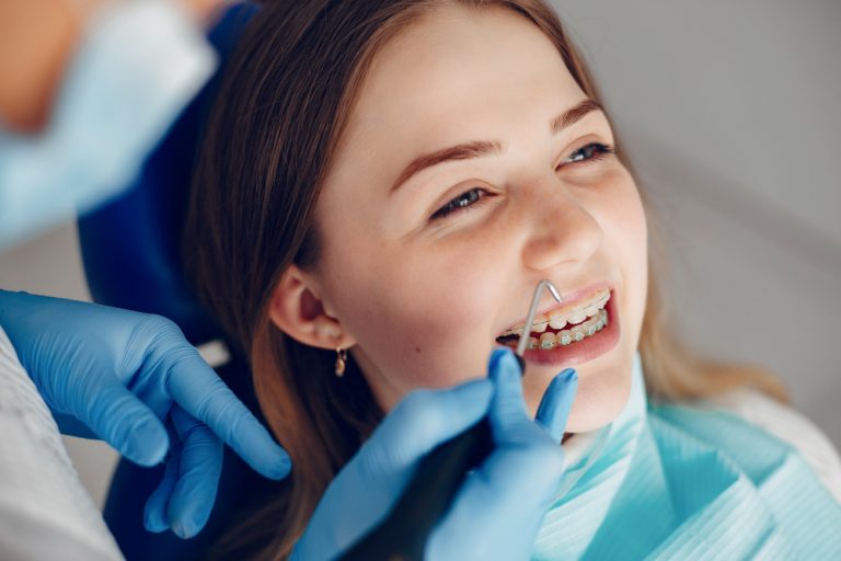 beautiful-girl-sitting-in-the-dentist-s-office (1)